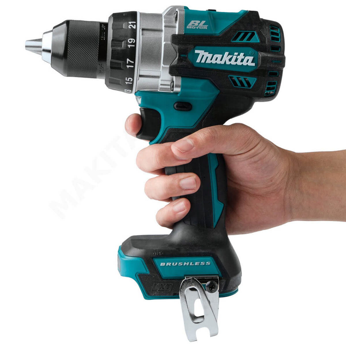 Hand holding a Makita cordless drill on a white background