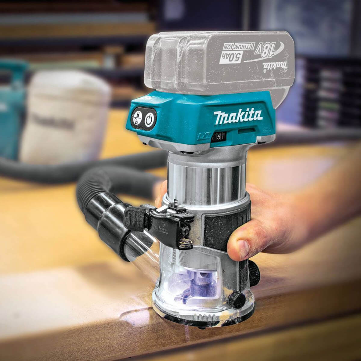 Makita power tool being used on a wooden surface