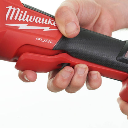 Hand holding a Milwaukee tool with a white background